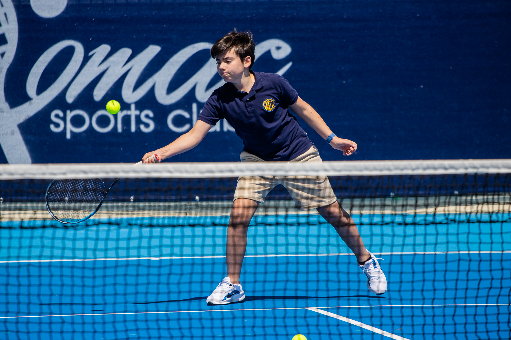 kid plays tennis