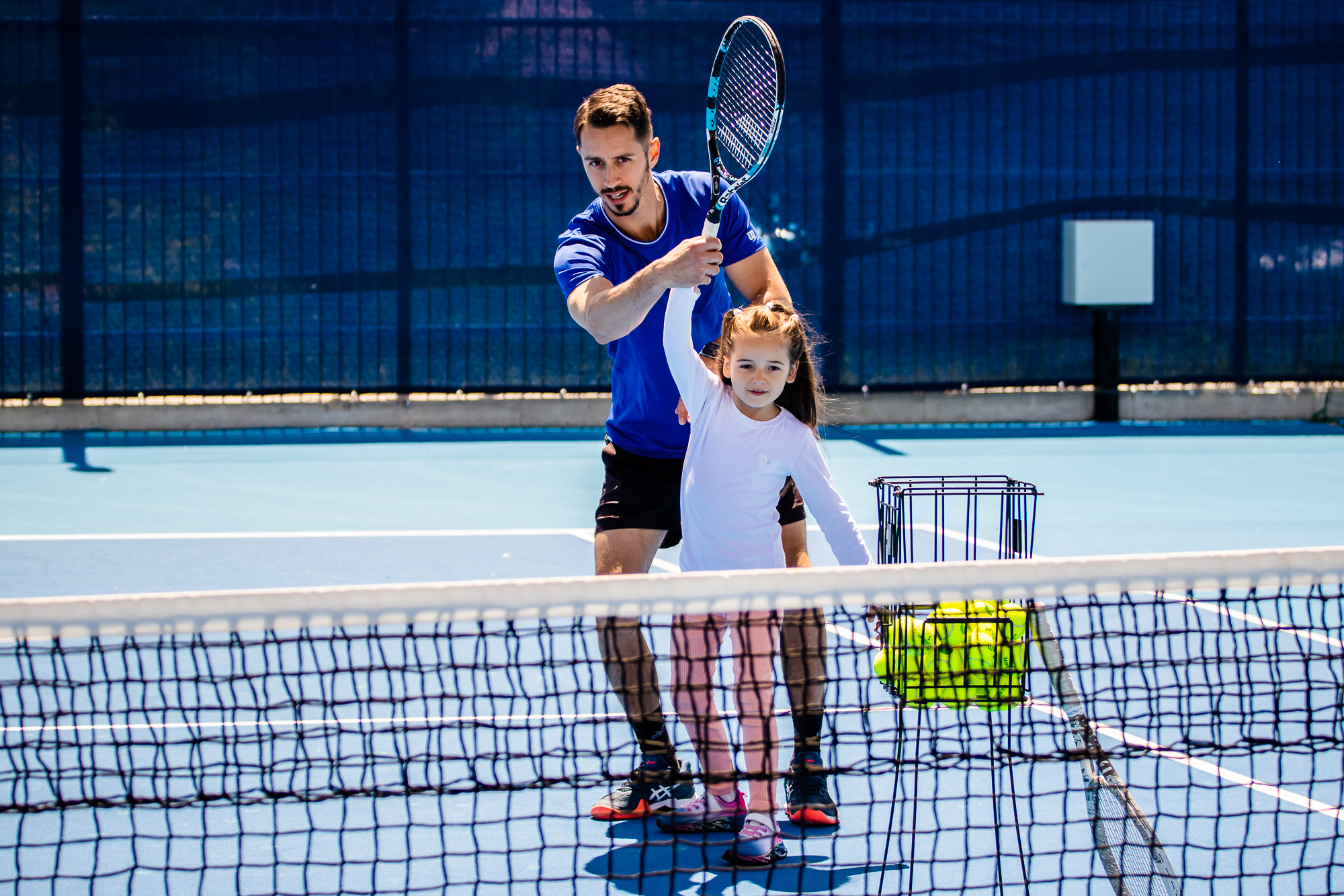 tennis coach and kid lesson